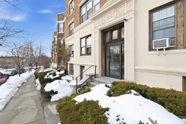 a view of a patio with couches and a fire pit