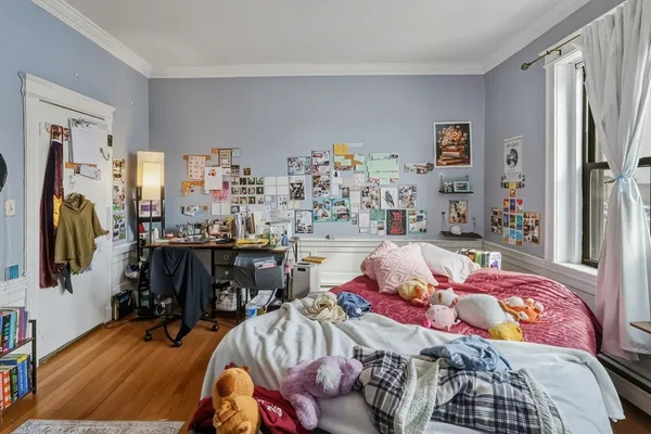 a bedroom with furniture and a closet