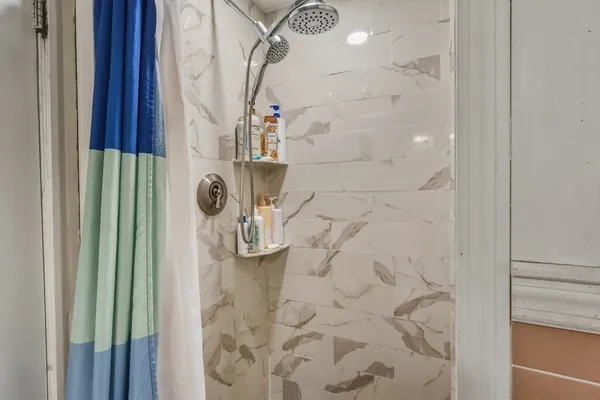 a bathroom with a sink vanity mirror and toilet
