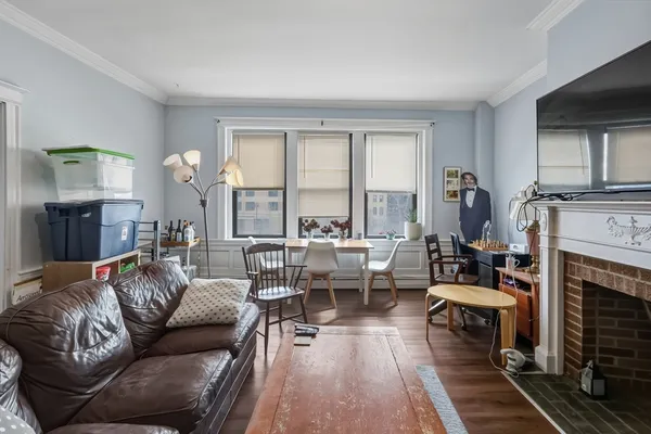 a living room with furniture fireplace and a flat screen tv