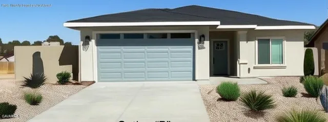 a view of a house with potted plants
