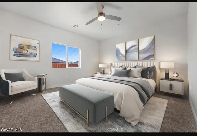 a bedroom with bed and a couch