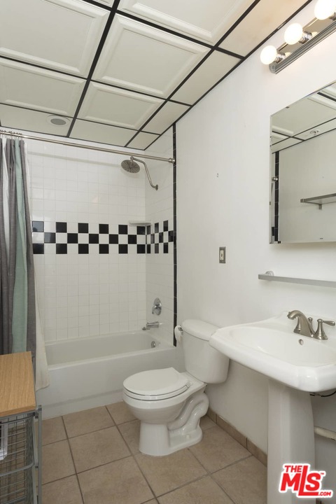 108 West 2nd Street, Unit 606 Los Angeles, CA 90012 - Photo 16 of 29 a bathroom with a sink toilet and shower