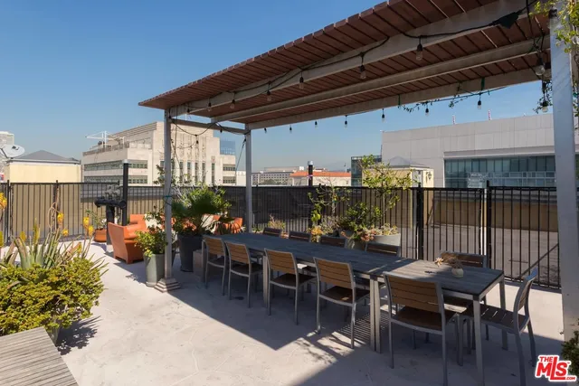 a view of a chairs and table in patio