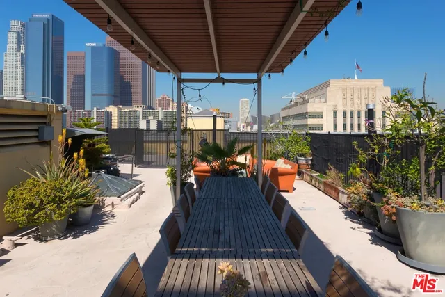 a view of swimming pool with outdoor seating