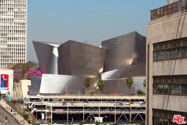 a kitchen with stainless steel appliances granite countertop a stove and a refrigerator