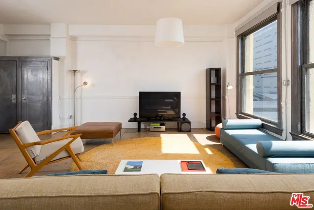 a living room with a couch and a flat screen tv