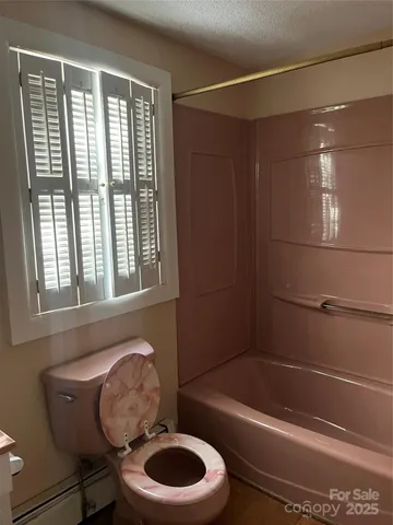 a bathroom with a sink a toilet and bathtub