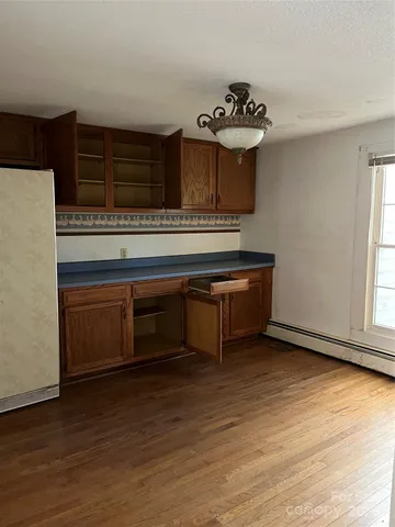 a kitchen with stainless steel appliances granite countertop a stove and a refrigerator