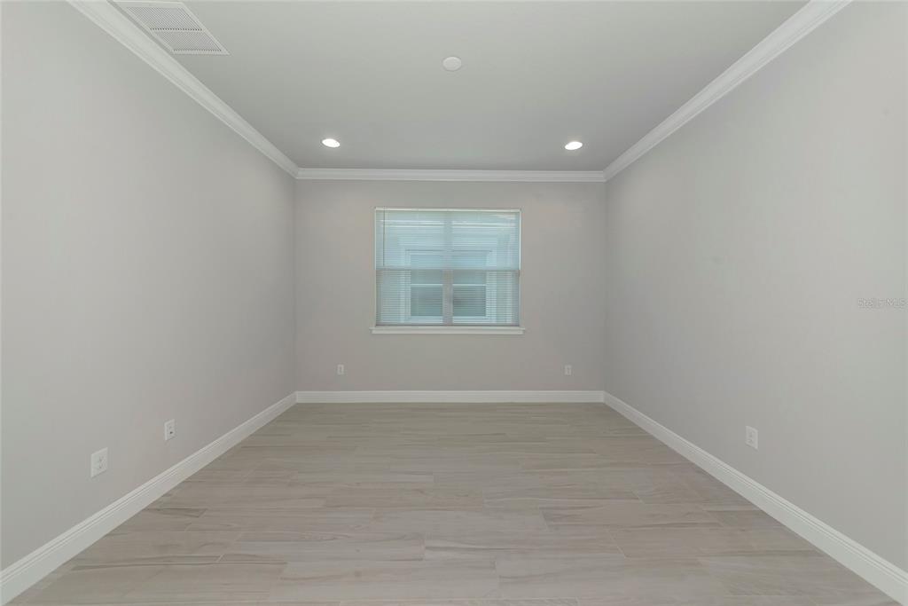 5798 Long Shore Loop Sarasota, FL 34238 - Photo 13 of 40 a view of an empty room with a window