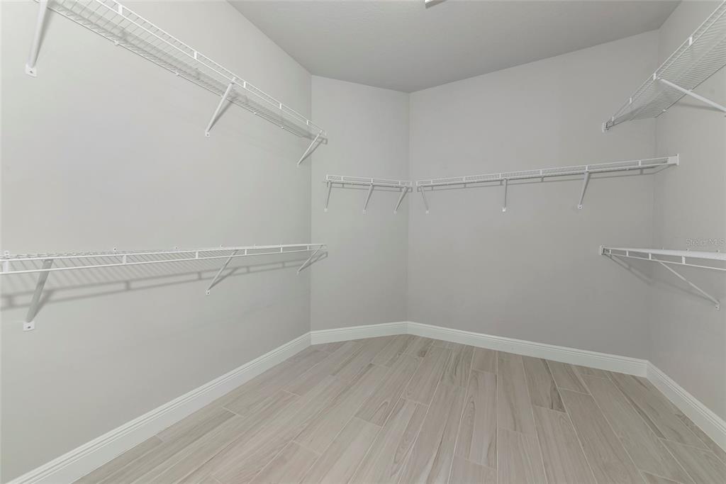 5798 Long Shore Loop Sarasota, FL 34238 - Photo 19 of 40 a view of a room with racks on the wall