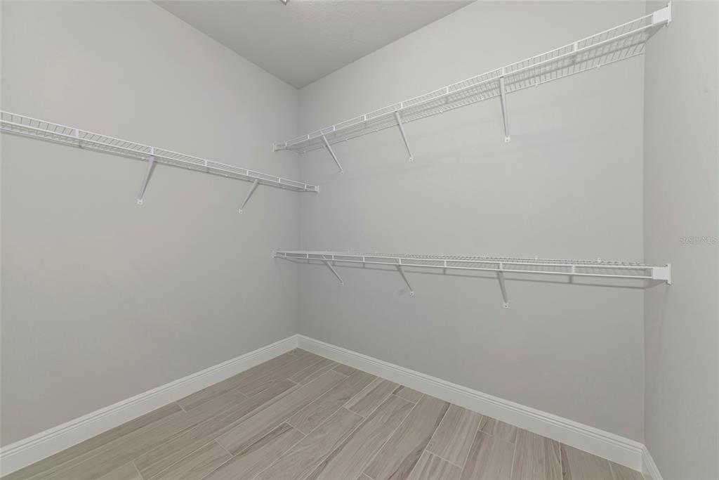5798 Long Shore Loop Sarasota, FL 34238 - Photo 20 of 40 a view of a room with racks on the wall