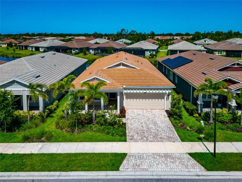 5798 Long Shore Loop Sarasota, FL 34238 - Photo 2 of 40 an aerial view of multiple houses with a yard