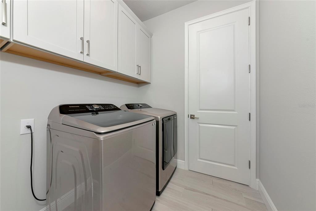 5798 Long Shore Loop Sarasota, FL 34238 - Photo 24 of 40 a utility room with dryer and washer