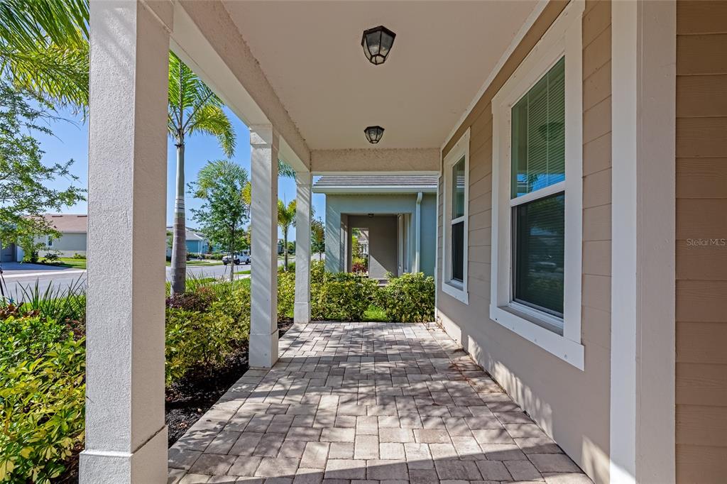 5798 Long Shore Loop Sarasota, FL 34238 - Photo 3 of 40 a front view of a house with a porch
