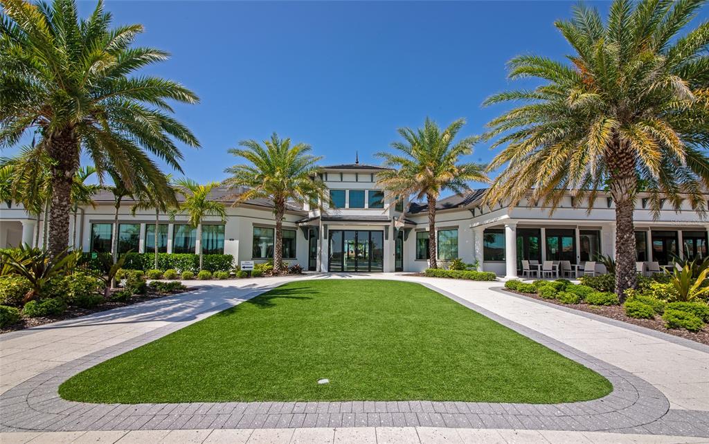 5798 Long Shore Loop Sarasota, FL 34238 - Photo 31 of 40 a front view of a house with a garden