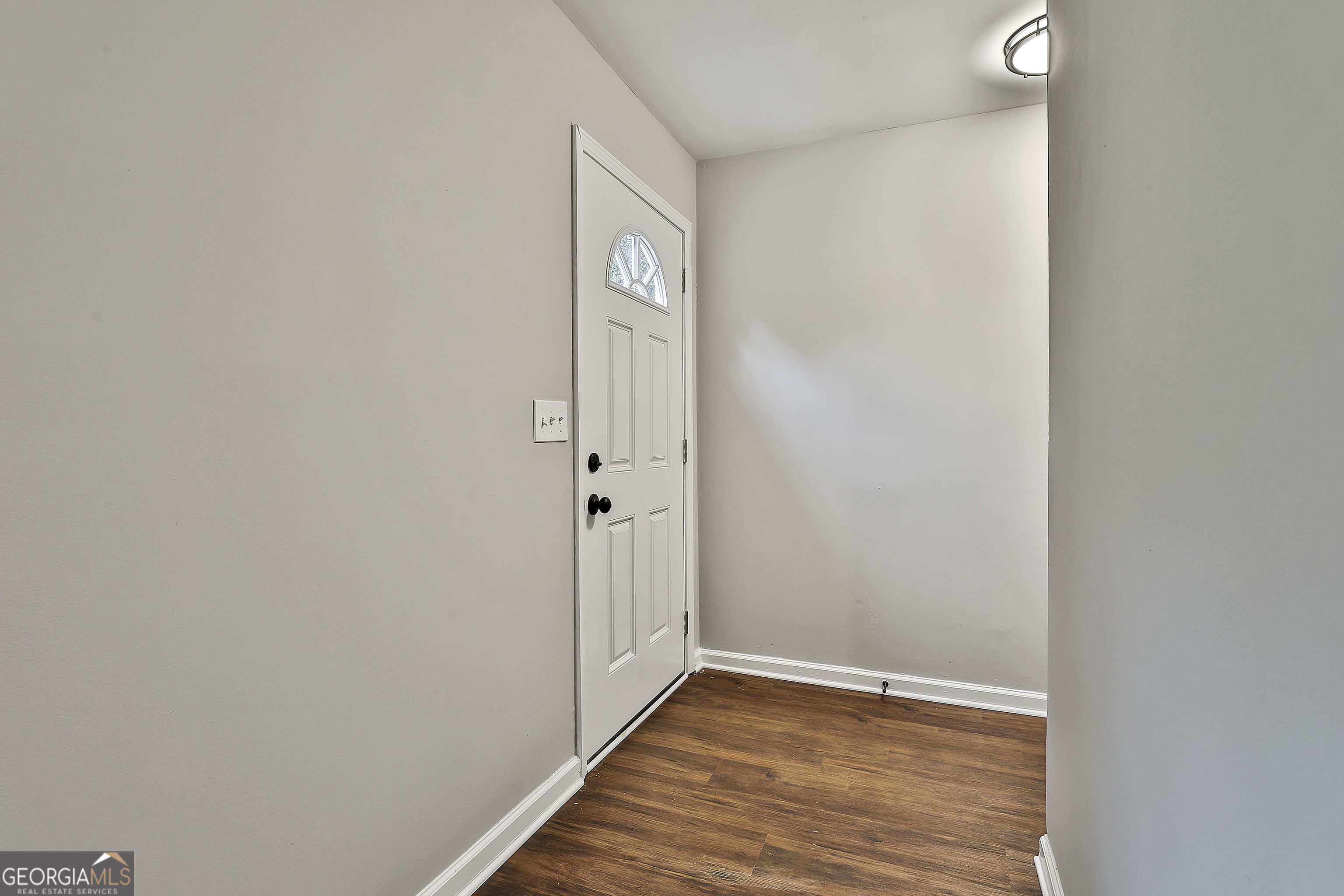 1606 Mcwilliams Barber Road Luthersville, GA 30251 - Photo 11 of 38 a view of an empty room with wooden floor and closet