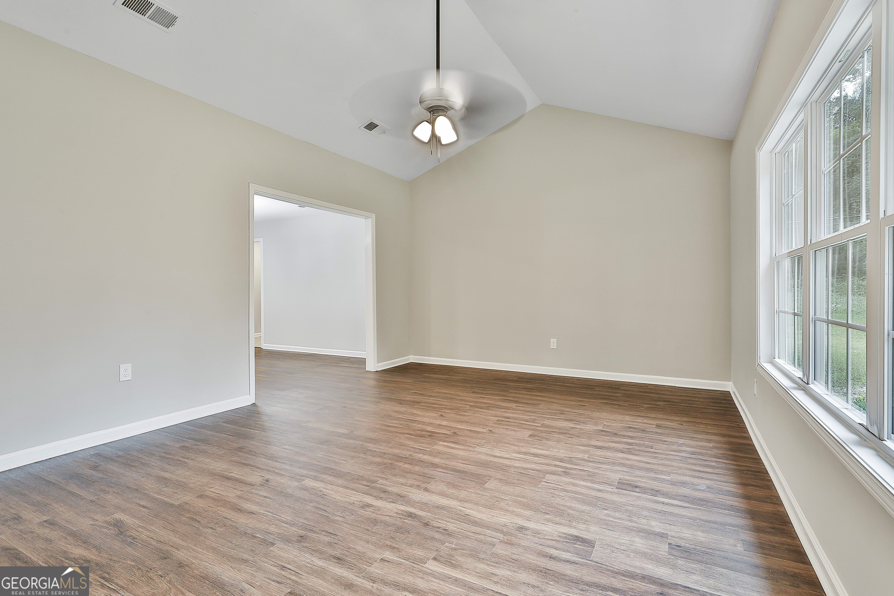 1606 Mcwilliams Barber Road Luthersville, GA 30251 - Photo 12 of 38 wooden floor in an empty room with a window