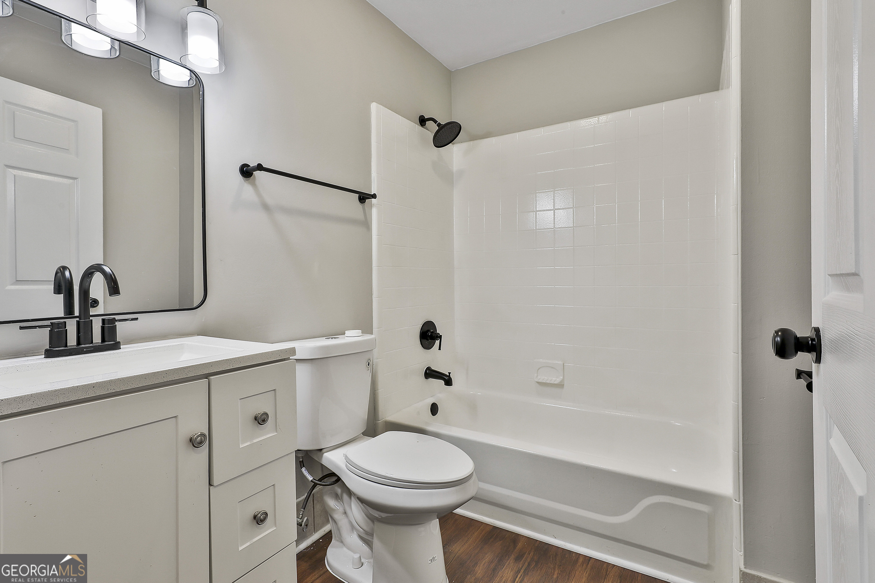 1606 Mcwilliams Barber Road Luthersville, GA 30251 - Photo 26 of 38 a bathroom with a sink a toilet and shower