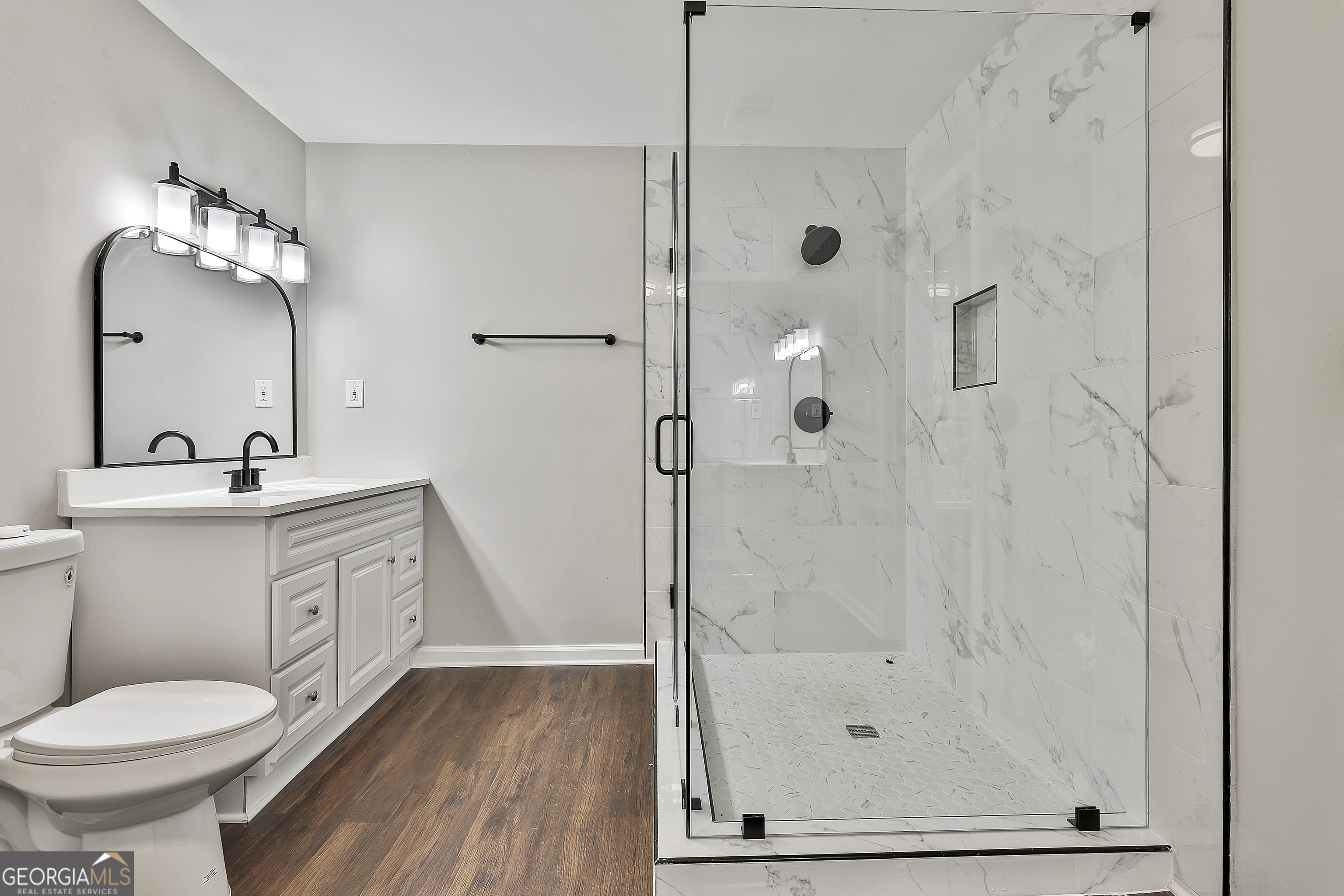 1606 Mcwilliams Barber Road Luthersville, GA 30251 - Photo 31 of 38 a bathroom with a sink toilet and shower