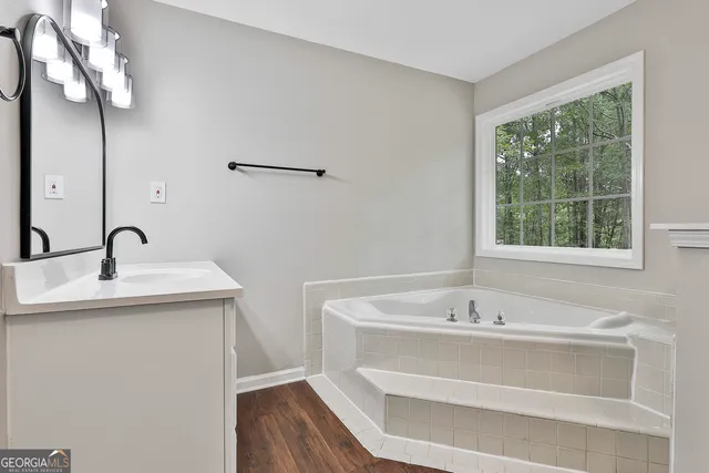 a view of a house with a big yard and palm trees