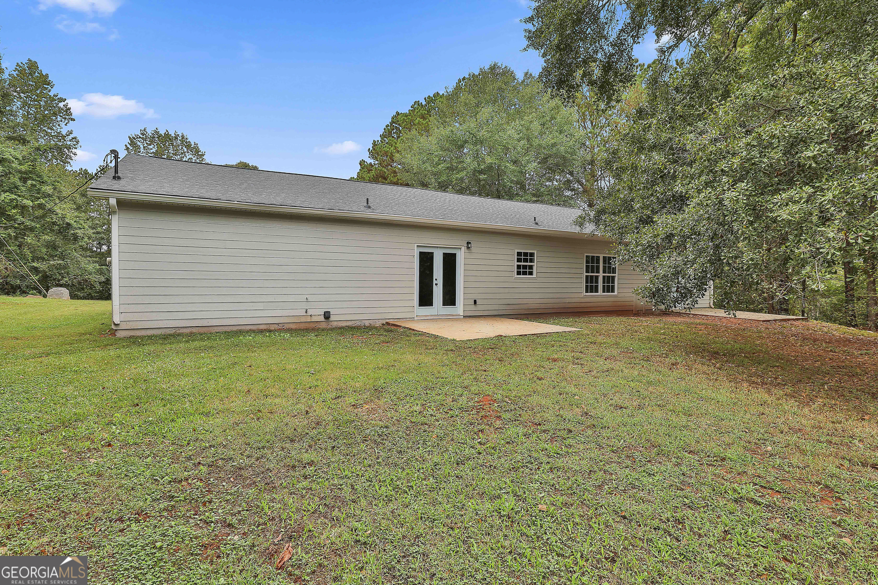 1606 Mcwilliams Barber Road Luthersville, GA 30251 - Photo 34 of 38 a backyard of a house with lots of green space