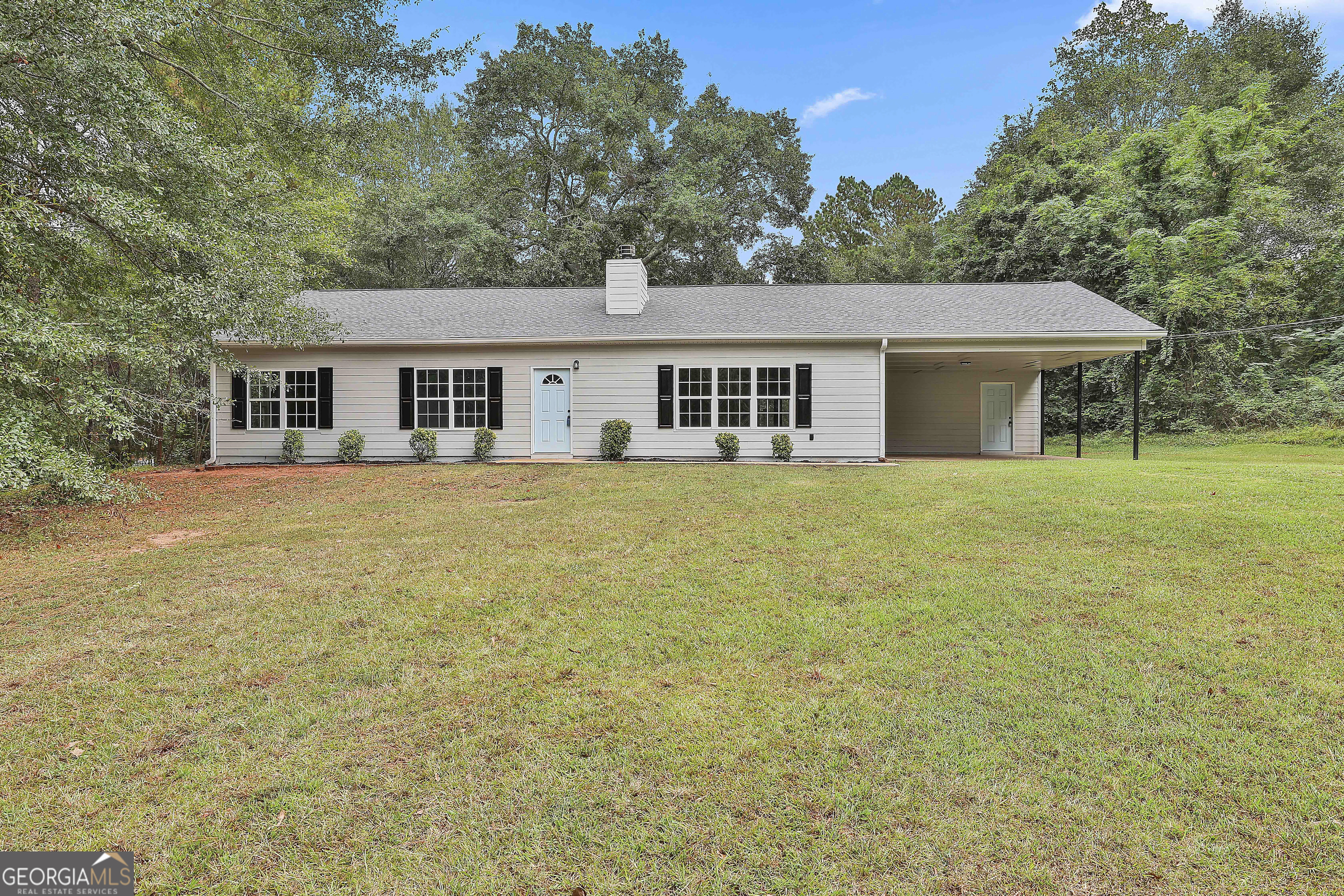1606 Mcwilliams Barber Road Luthersville, GA 30251 - Photo 7 of 38 a house that has a big yard with large trees