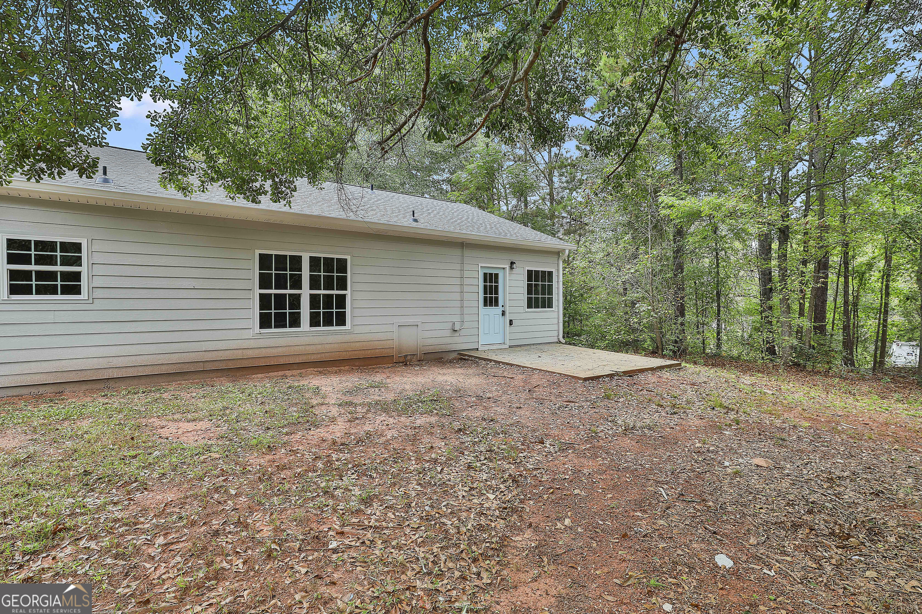 1606 Mcwilliams Barber Road Luthersville, GA 30251 - Photo 8 of 38 a view of a house with a backyard