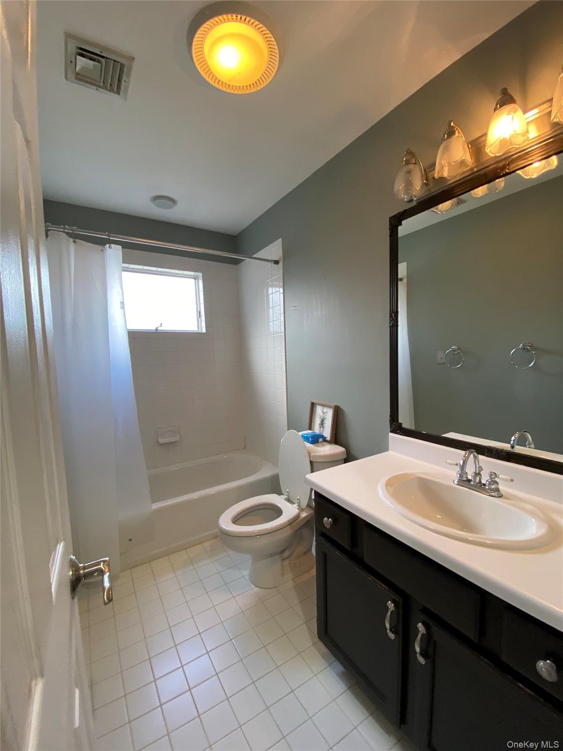31 Denman Road Middletown, NY 10940 - Photo 13 of 18 a bathroom with a sink double vanity and a mirror