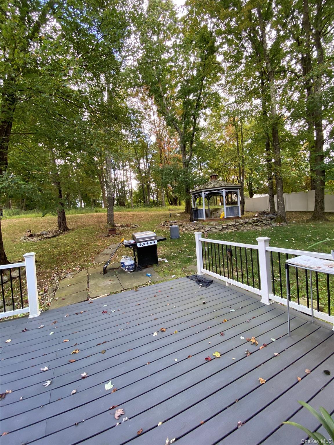 31 Denman Road Middletown, NY 10940 - Photo 16 of 18 a view of a deck with chairs and wooden fence