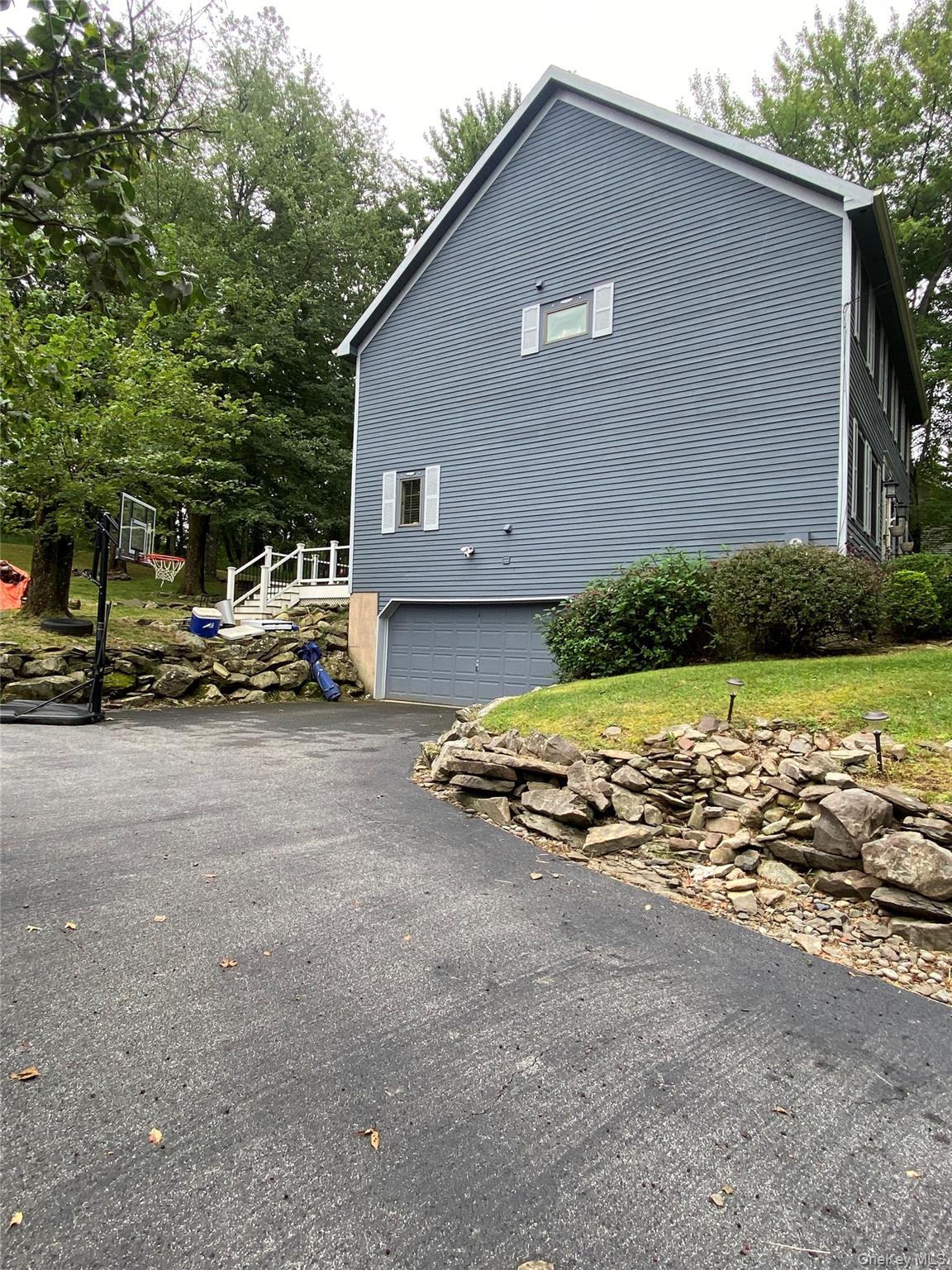 31 Denman Road Middletown, NY 10940 - Photo 18 of 18 a view of car parked in front of house