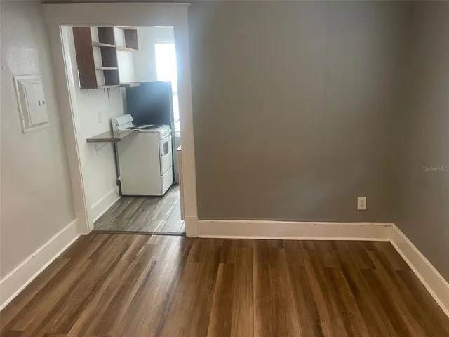 a view of wooden floor in an empty room