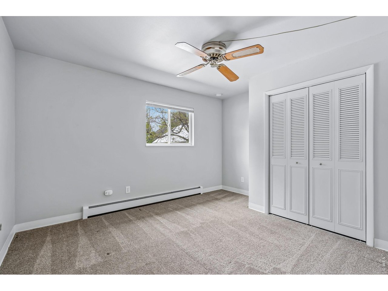 809 East Drake Road, Unit C107 Fort Collins, CO 80525 - Photo 12 of 24 a view of an empty room with a window