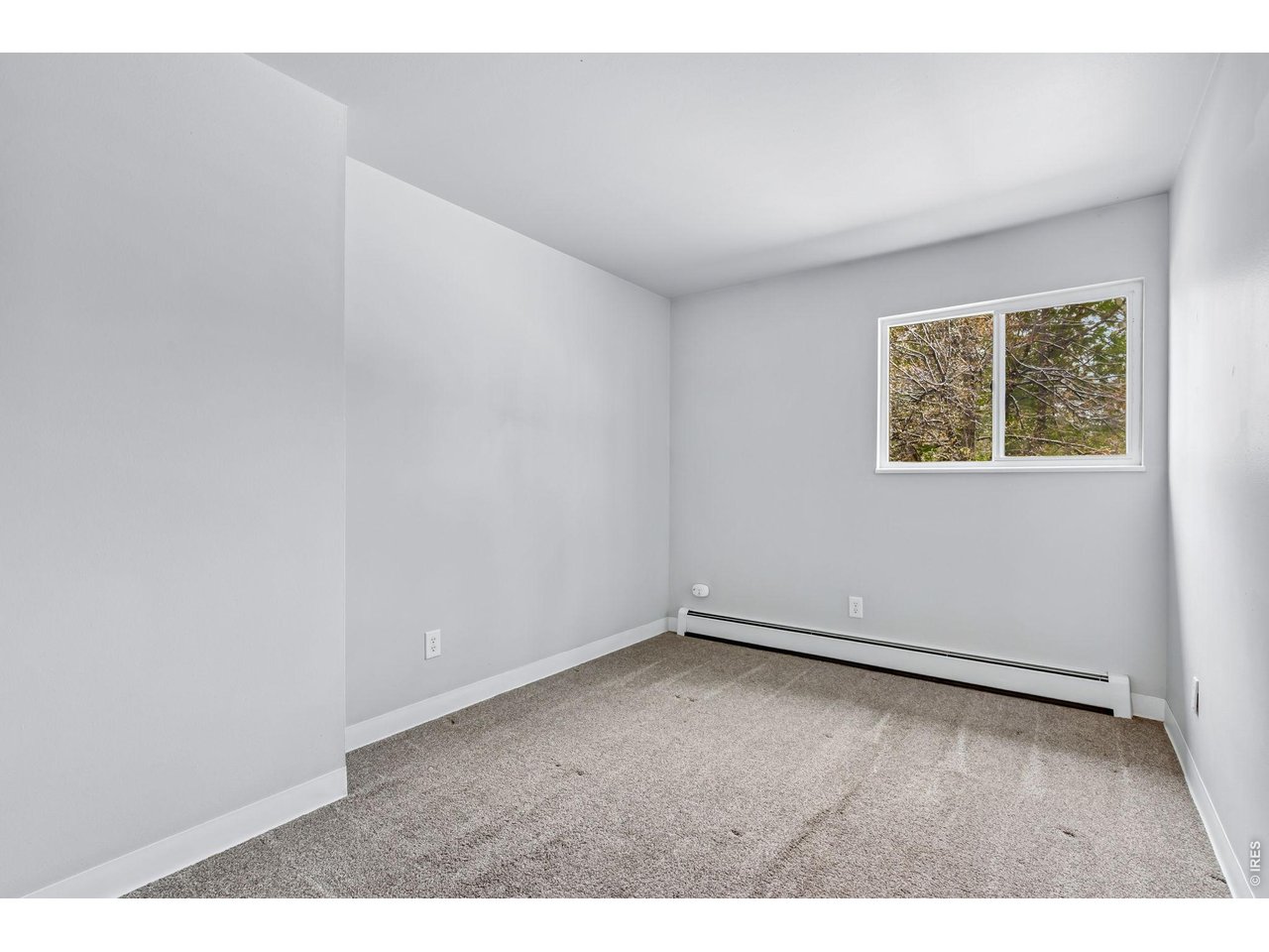 809 East Drake Road, Unit C107 Fort Collins, CO 80525 - Photo 17 of 24 an empty room with a window