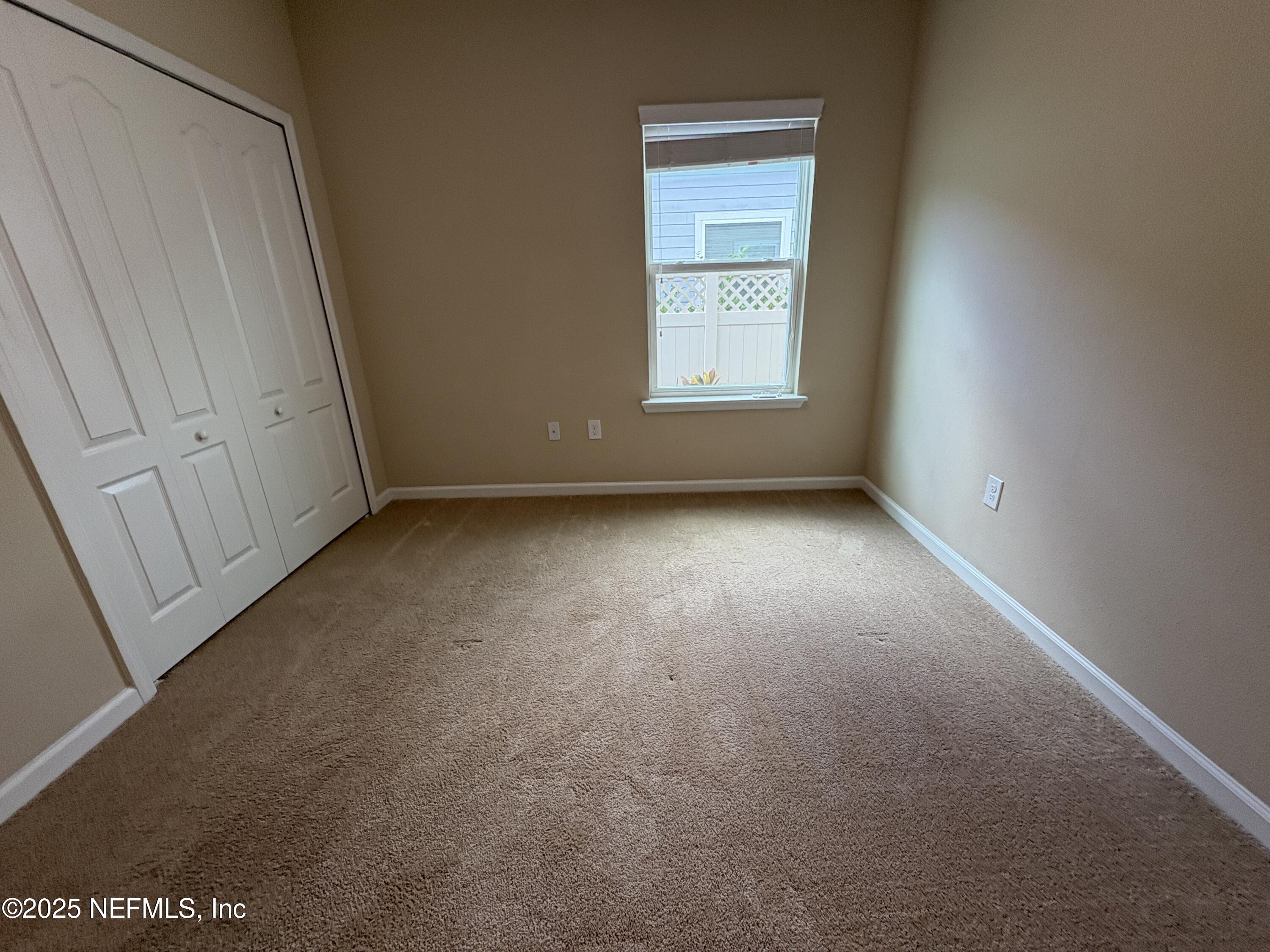 173 Athens Drive St. Augustine, FL 32092 - Photo 15 of 25 an empty room with a window