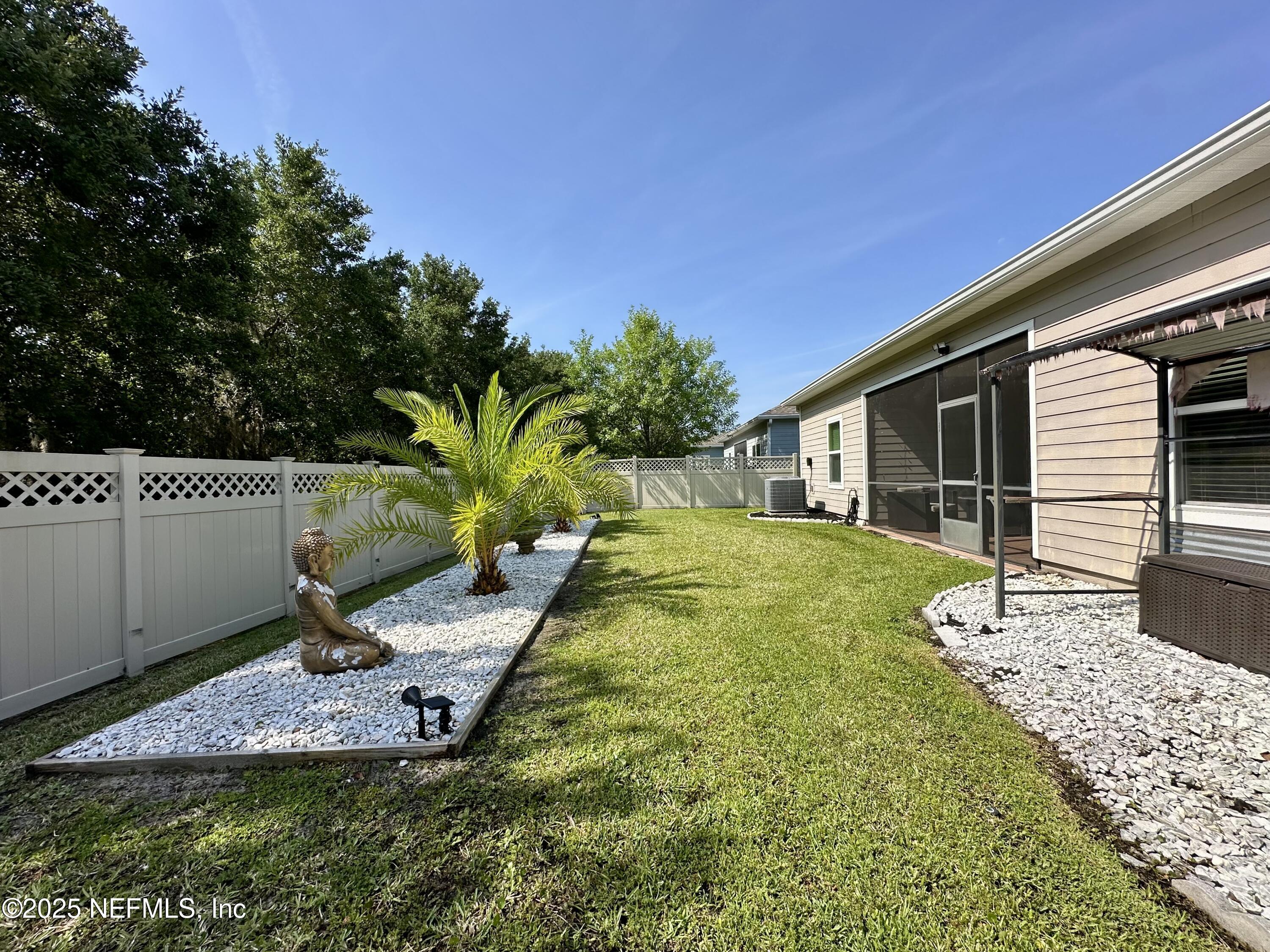 173 Athens Drive St. Augustine, FL 32092 - Photo 16 of 25 a view of a house with backyard and sitting area