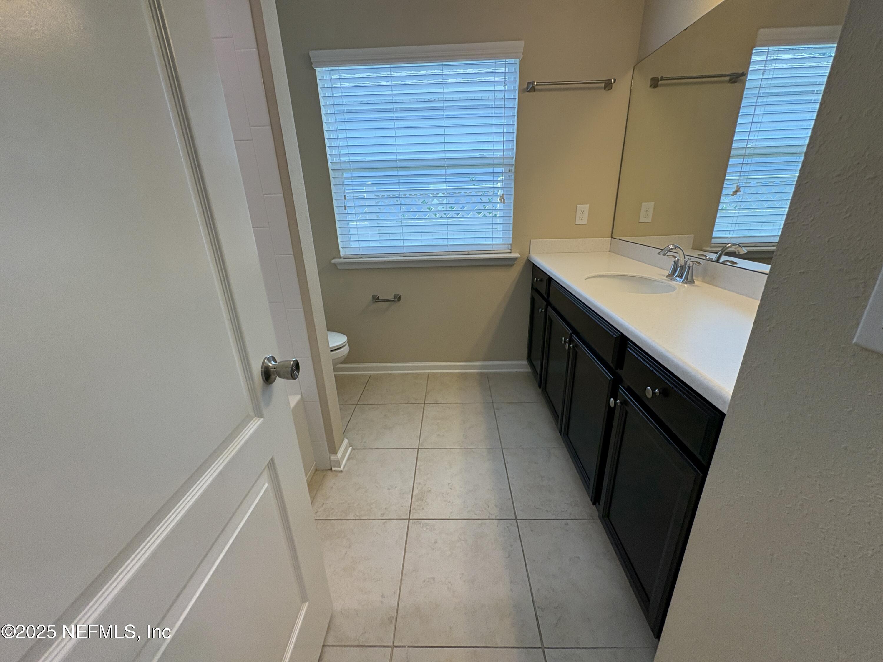 173 Athens Drive St. Augustine, FL 32092 - Photo 17 of 25 a bathroom with a sink a vanity and a bathtub