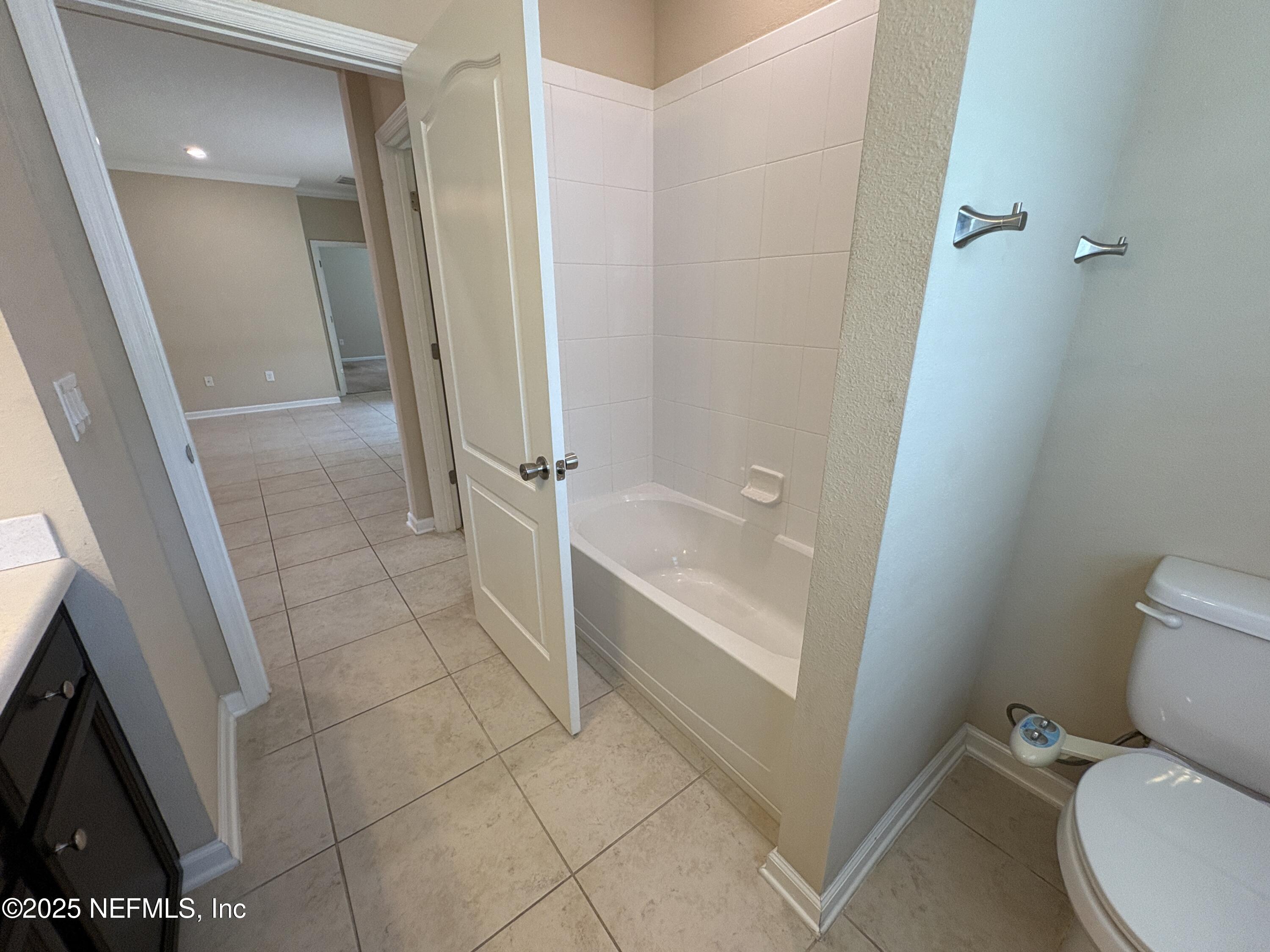 173 Athens Drive St. Augustine, FL 32092 - Photo 18 of 25 a bathroom with a toilet and a shower