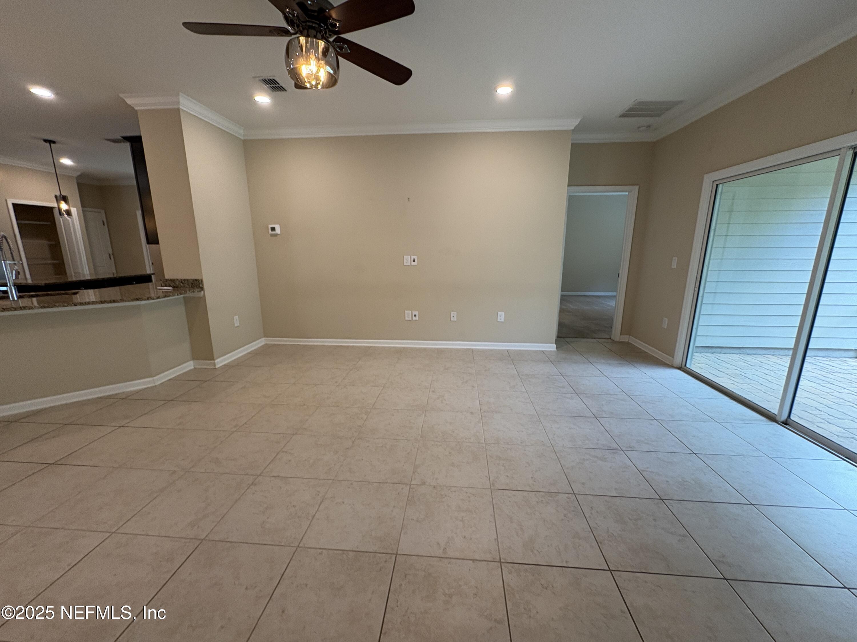 173 Athens Drive St. Augustine, FL 32092 - Photo 5 of 25 a view of an empty room with a window