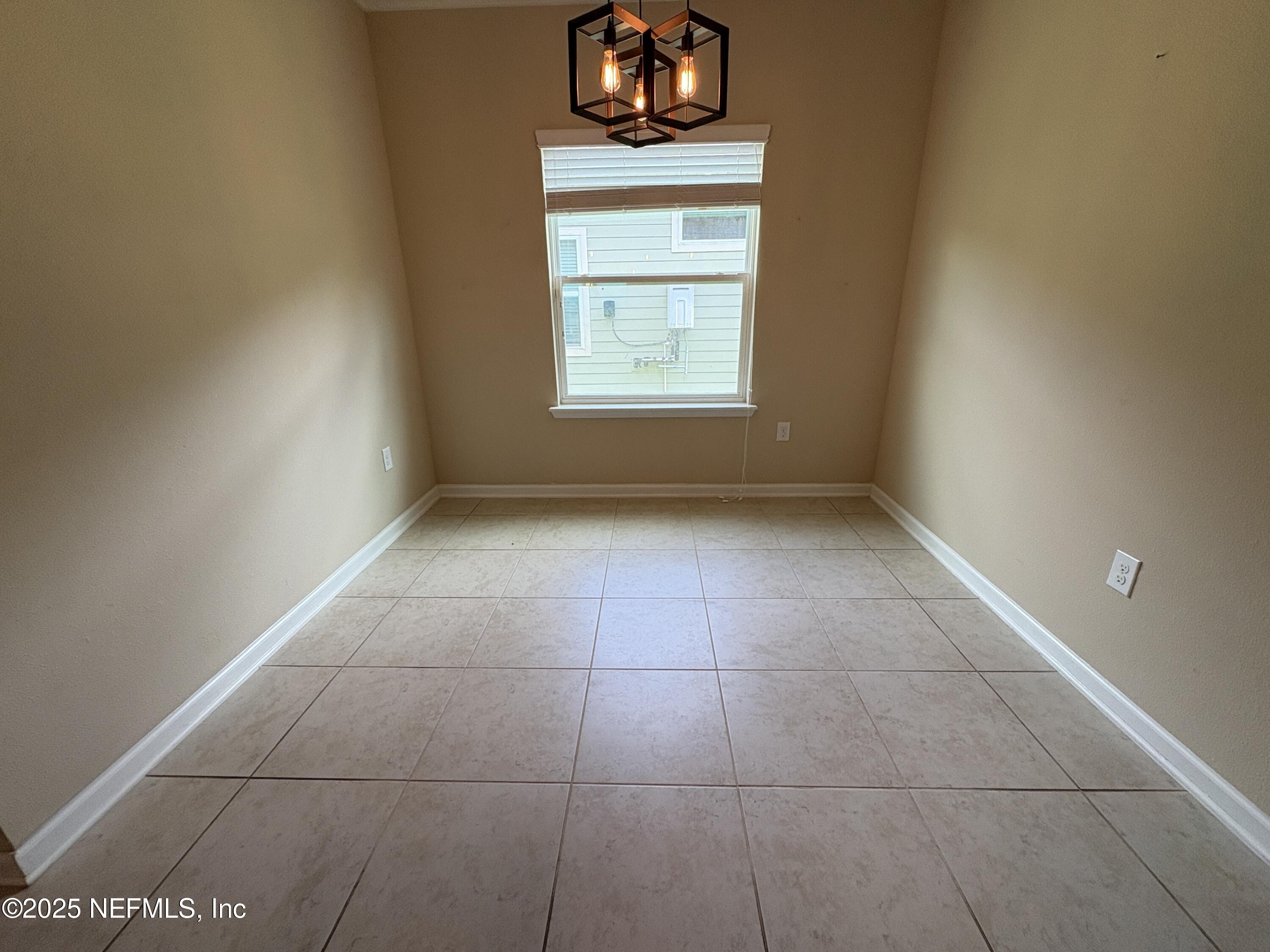 173 Athens Drive St. Augustine, FL 32092 - Photo 6 of 25 a view of an empty room with a window