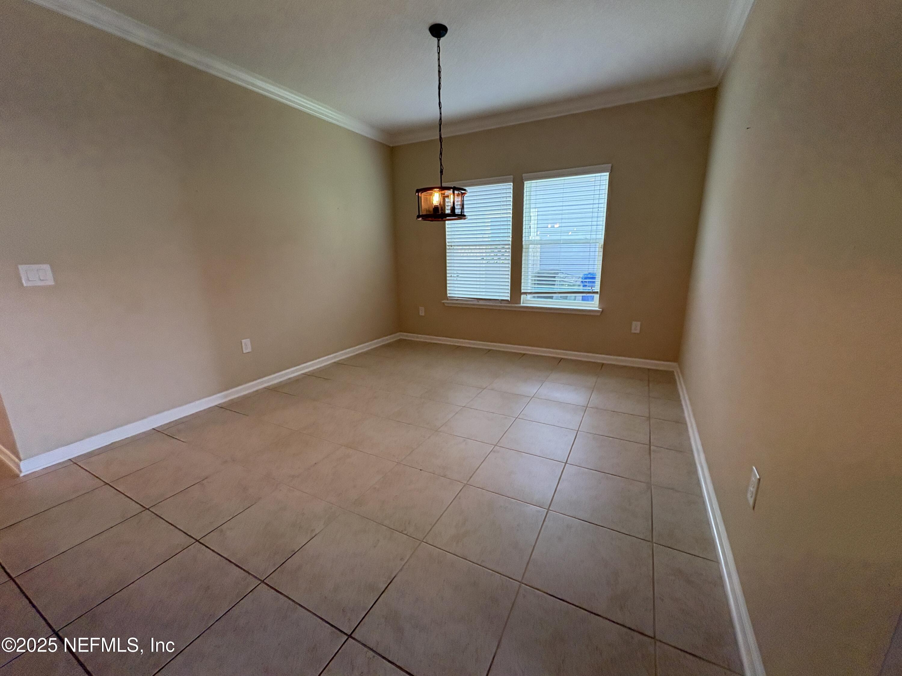 173 Athens Drive St. Augustine, FL 32092 - Photo 7 of 25 a view of an empty room with a window