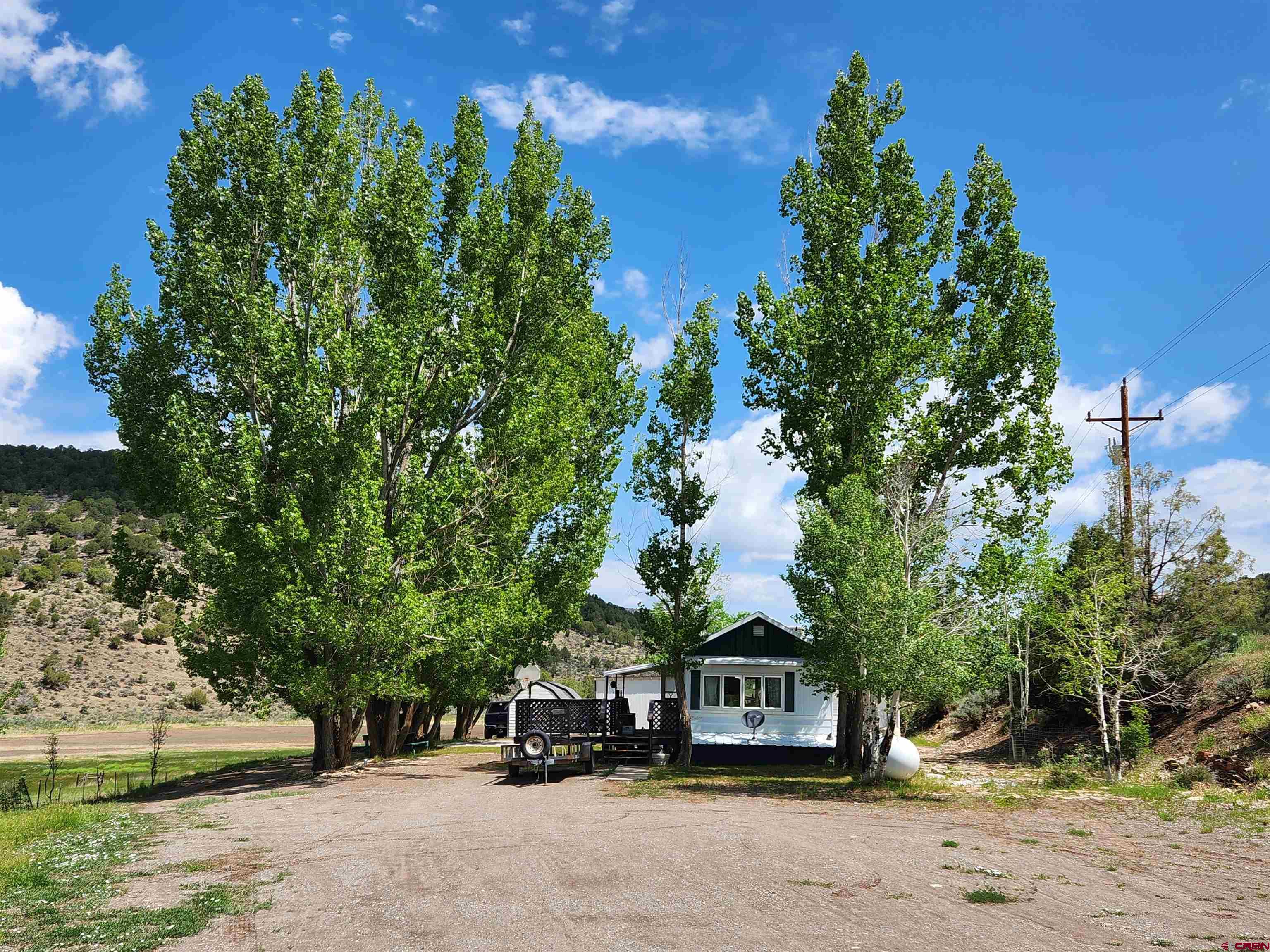 925 County Road 12 Ridgway, CO 81432 - Photo 1 of 2 a car parked on the side of the road