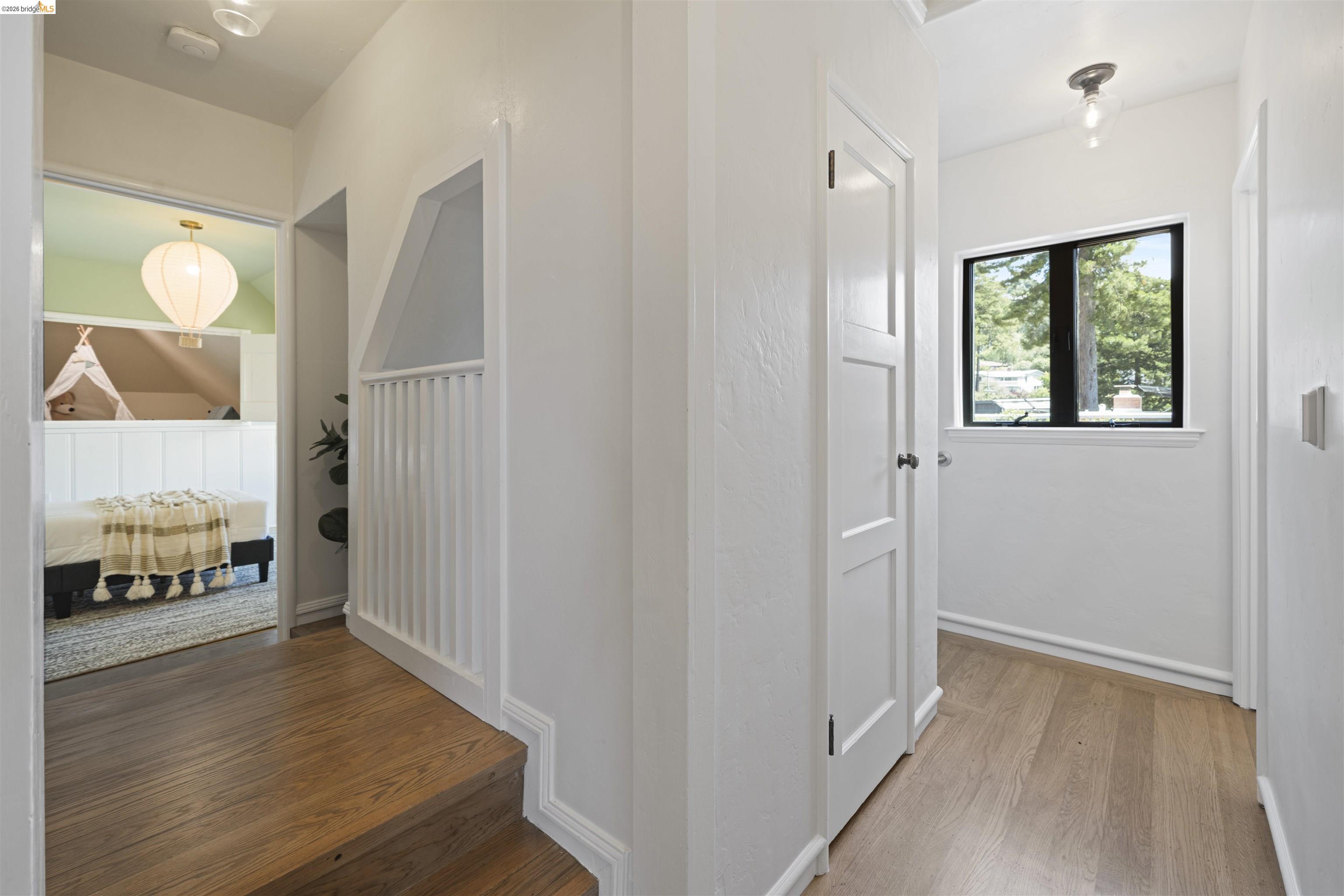 1170 Sterling Avenue Berkeley, CA 94708 - Photo 31 of 52 Hallway featuring wood finished floors and baseboards