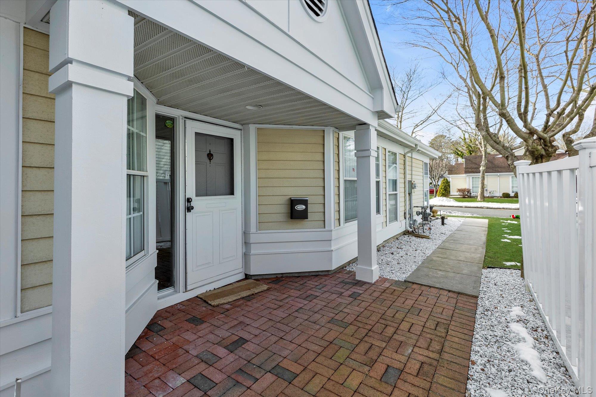 289 Glen Drive Ridge, NY 11961 - Photo 18 of 19 a front view of a house with a yard