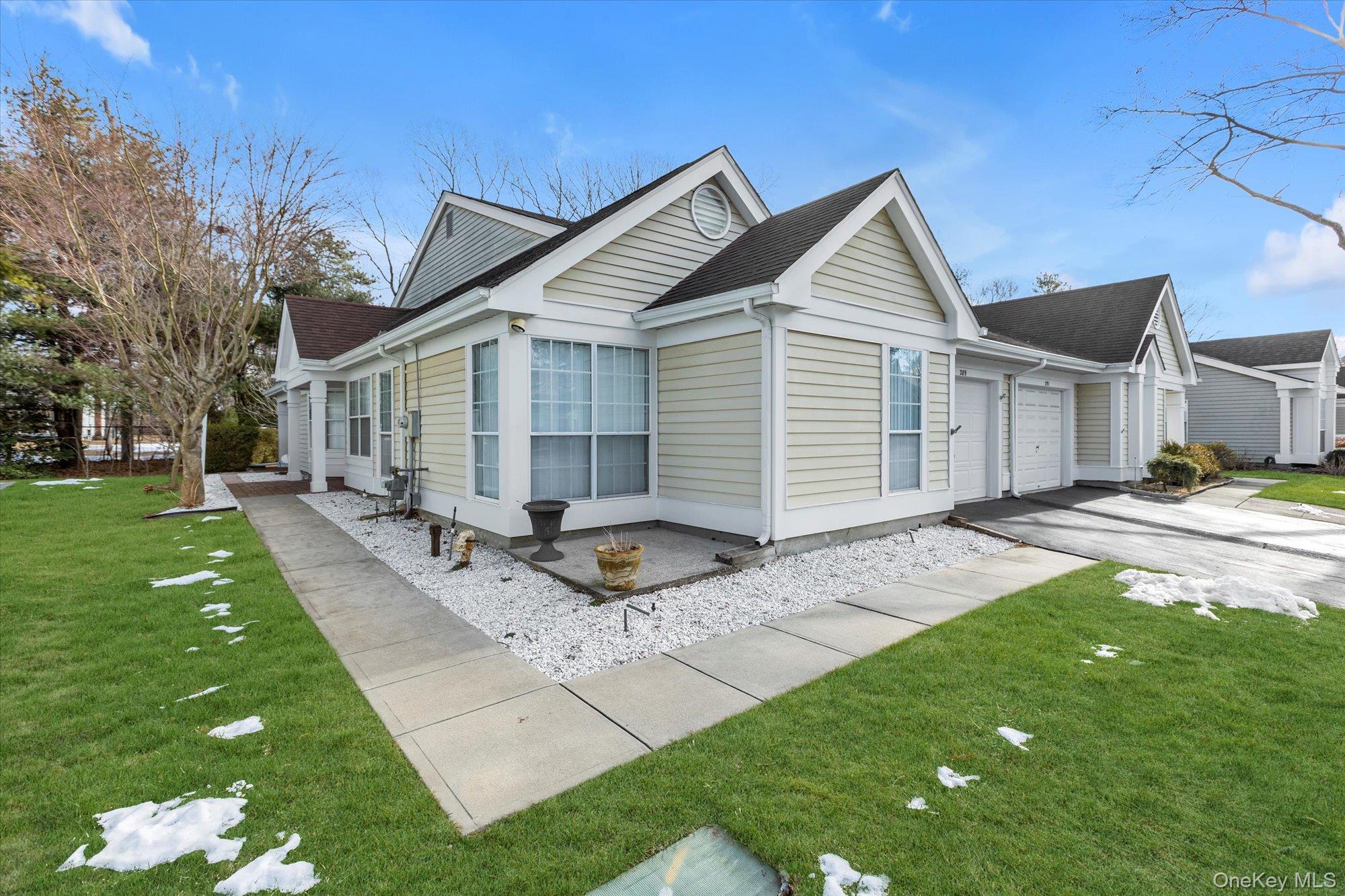 289 Glen Drive Ridge, NY 11961 - Photo 19 of 19 a backyard of a house with garden and barbeque oven