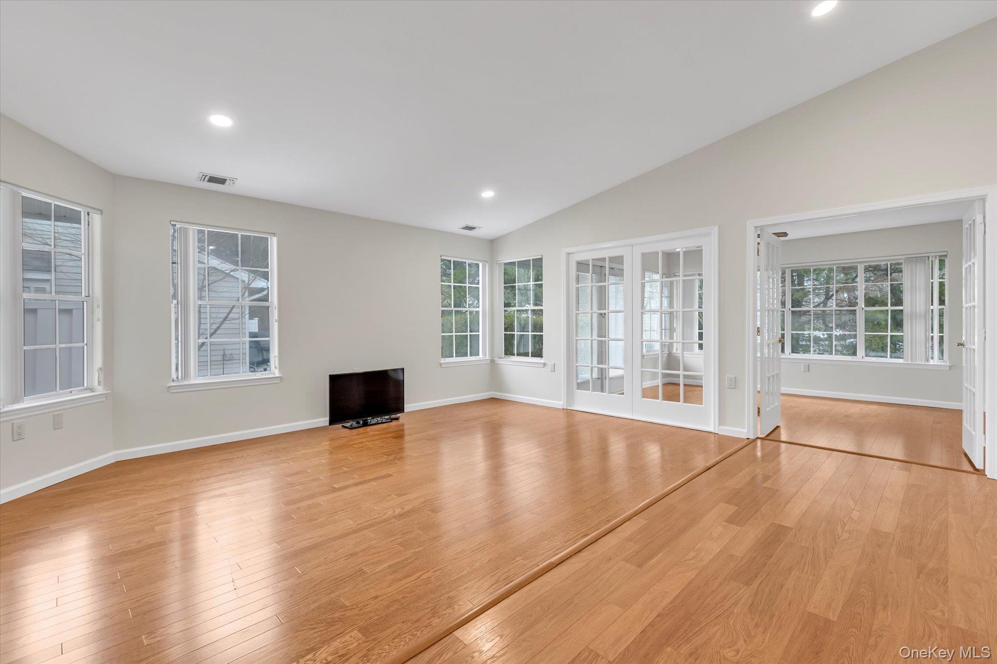 289 Glen Drive Ridge, NY 11961 - Photo 3 of 19 a view of empty room with wooden floor and fan