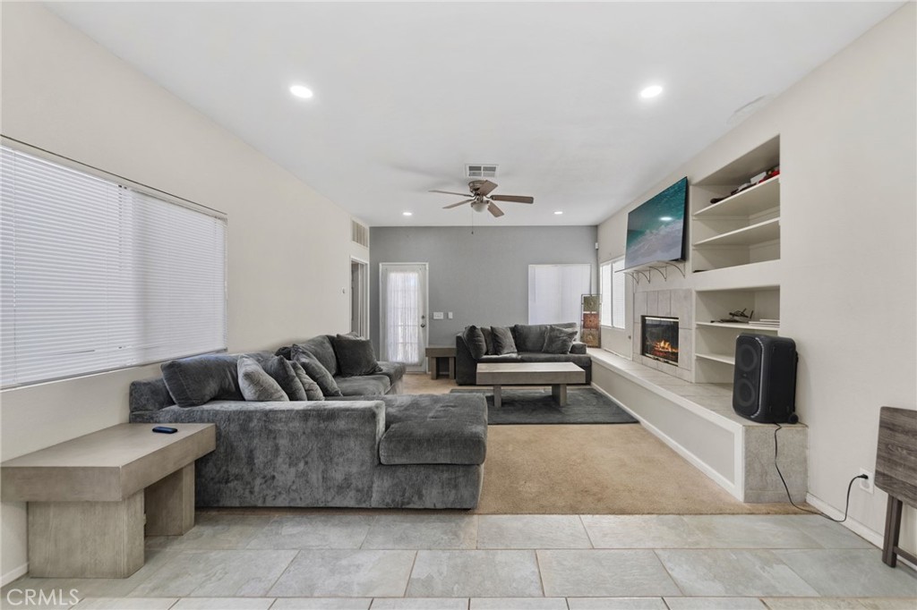 1494 Rabbit Peak Way Hemet, CA 92545 - Photo 19 of 45 a living room with furniture and a couch