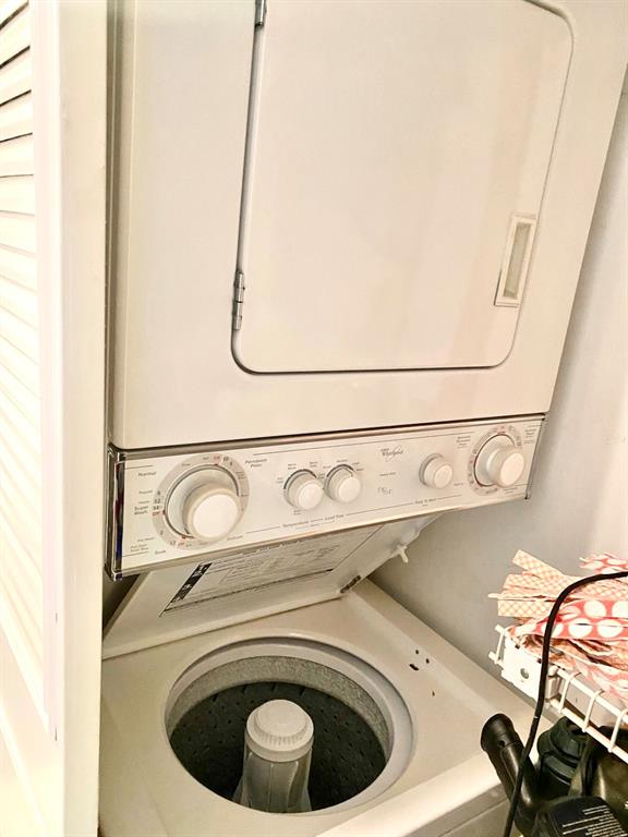 3002 Northeast 5th Terrace, Unit 209B Wilton Manors, FL 33334 - Photo 17 of 25 a utility room with dryer and washer