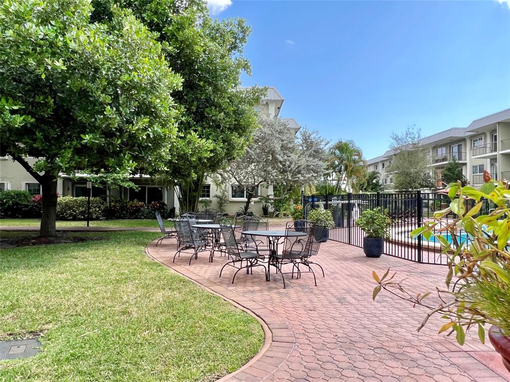3002 Northeast 5th Terrace, Unit 209B Wilton Manors, FL 33334 - Photo 23 of 25 a view of a backyard with sitting area