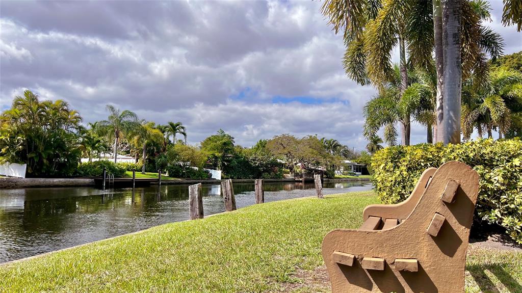 3002 Northeast 5th Terrace, Unit 209B Wilton Manors, FL 33334 - Photo 24 of 25 a view of a lake with a garden